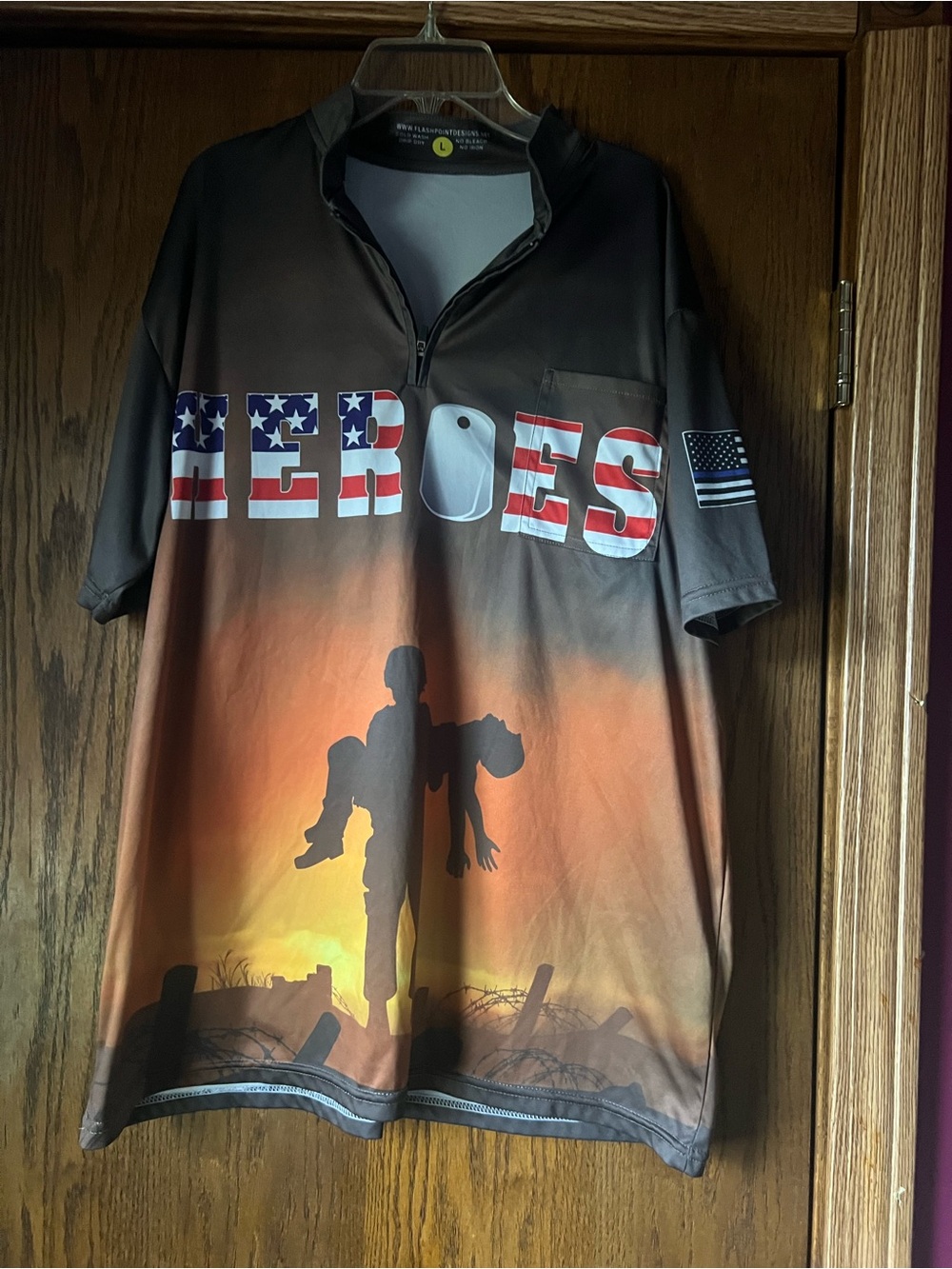 short-sleeve patriotic golf shirt featuring a "Heroes" graphic C4